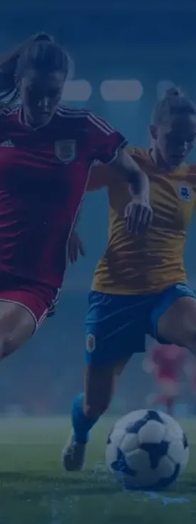 Two soccer players challenging for the ball